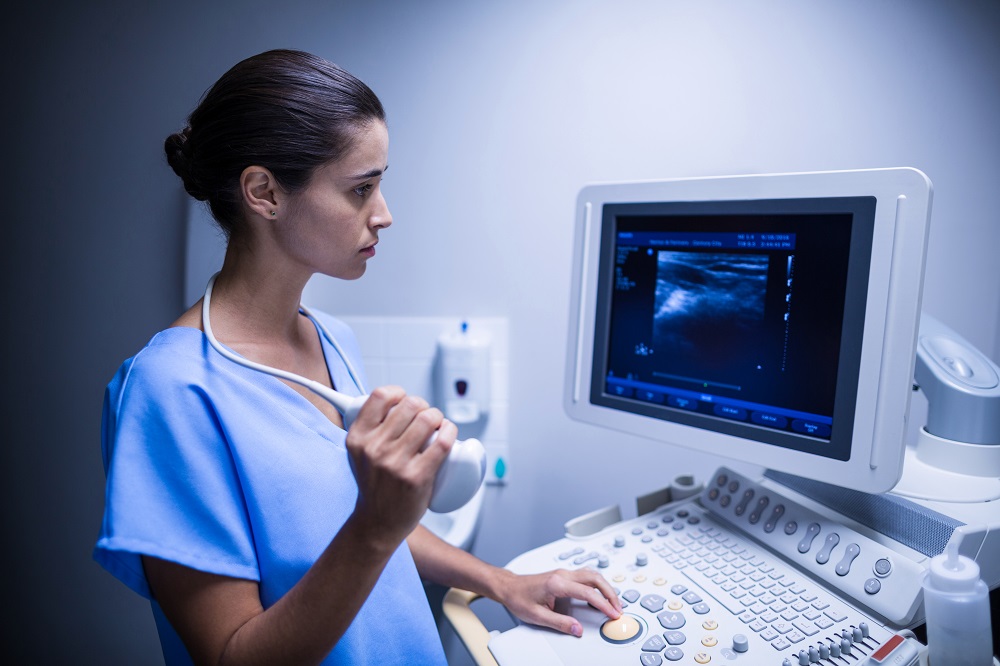 Nurse using ultrasonic device in hospital Nurse using ultrasonic device in hospital | Breast Cancer Treatment in Pune | Dr. Sumit Shah